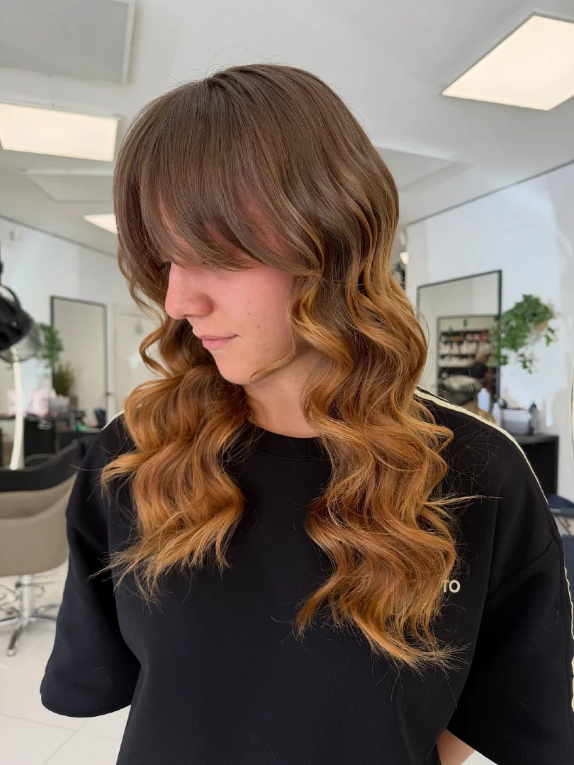 Brown to Caramel Ombre Layers with Side Swept Bangs and Curls