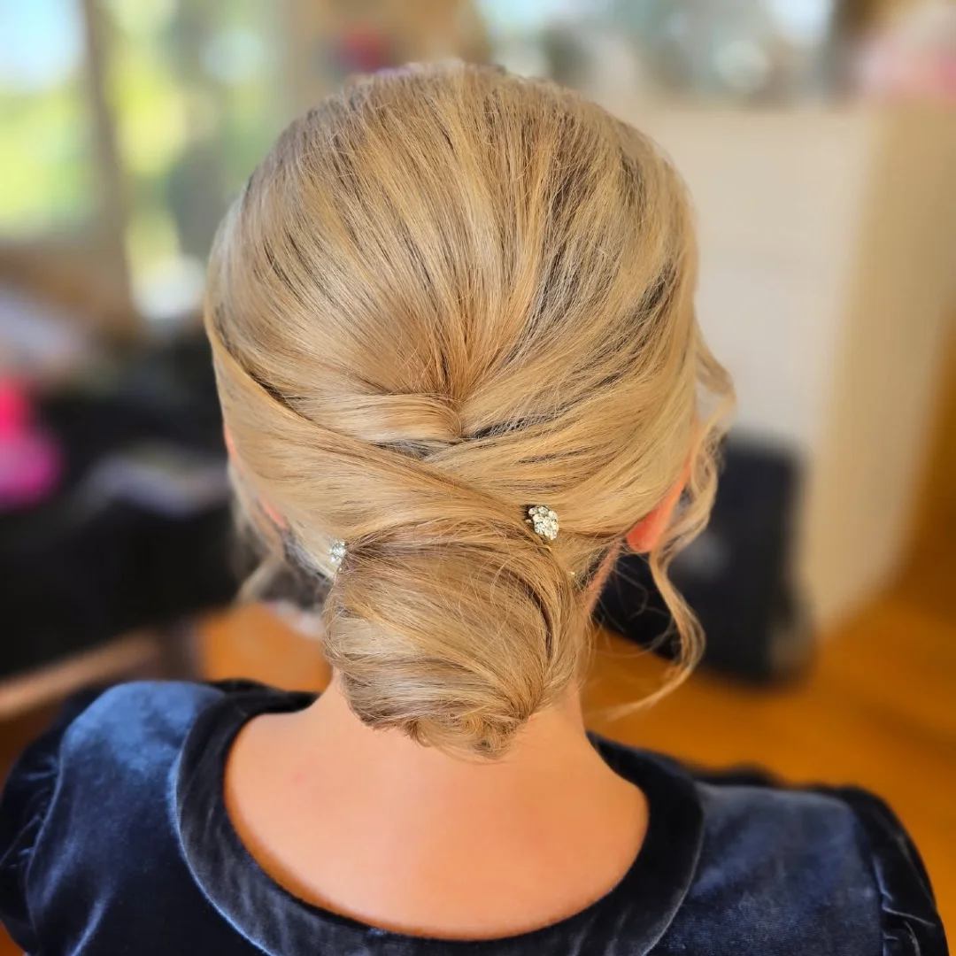 Cross-Tucked Low Updo with Rhinestone Pin