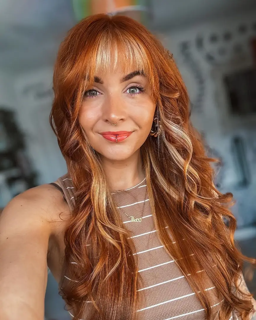 Curtain Bangs on Long Curly Auburn Hair with Highlights