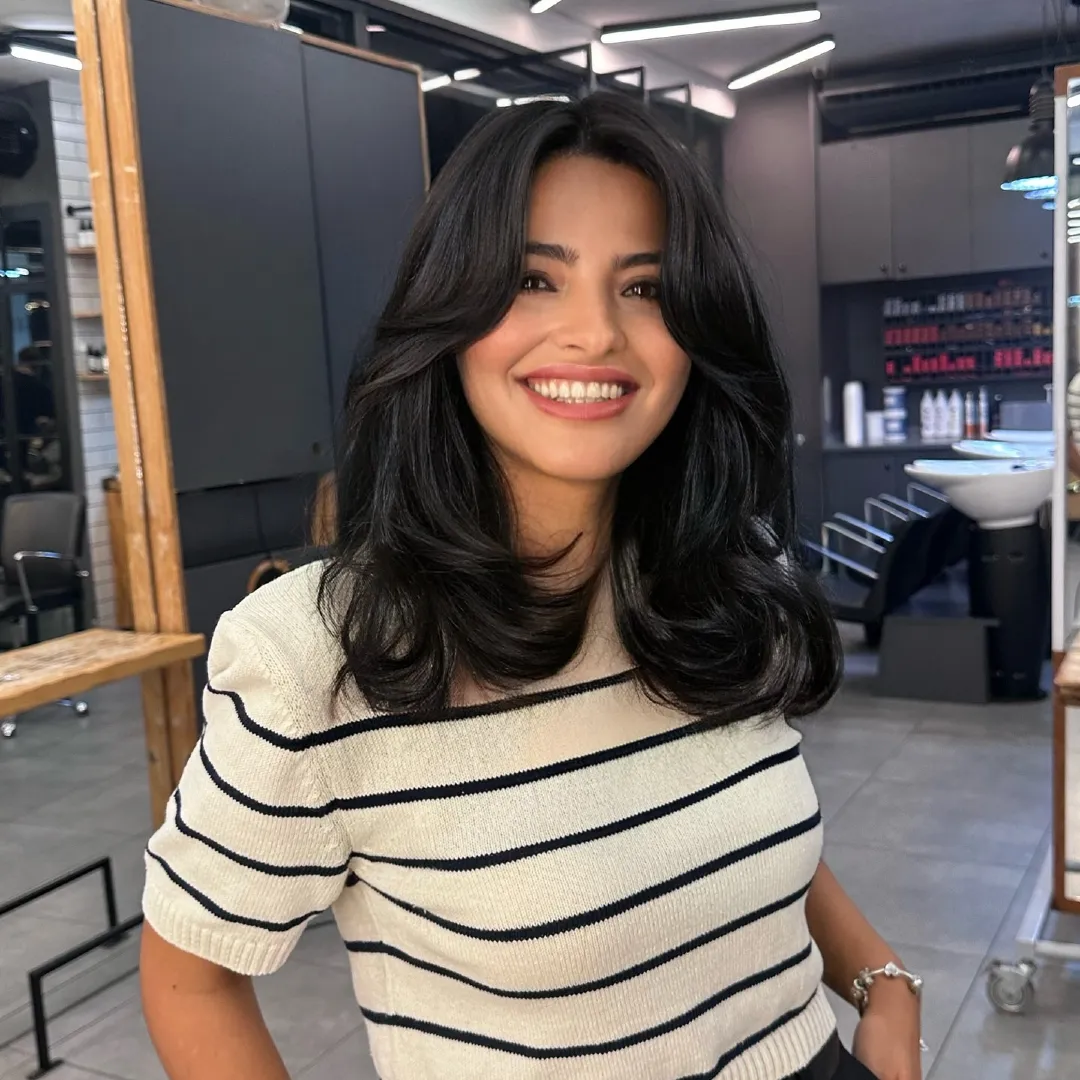 Curtain Bangs on Medium Black Hair with Voluminous Blowout