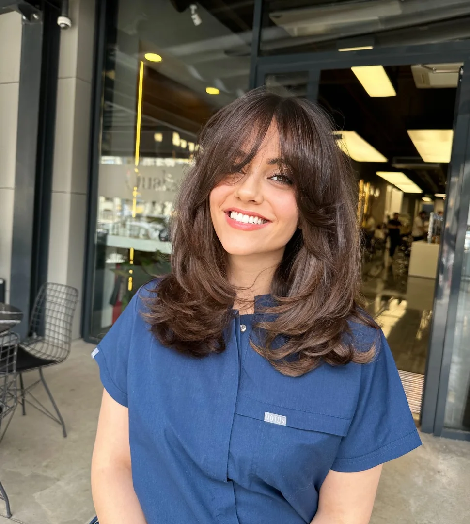 Curtain Bangs on Medium Brown Hair with Big Bouncy Blowout
