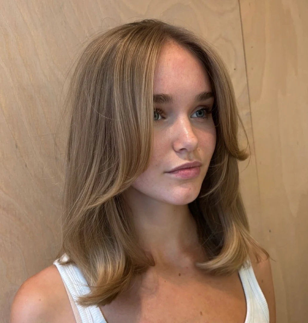 Curtain Bangs on Medium Honey Blonde Sleek Lob