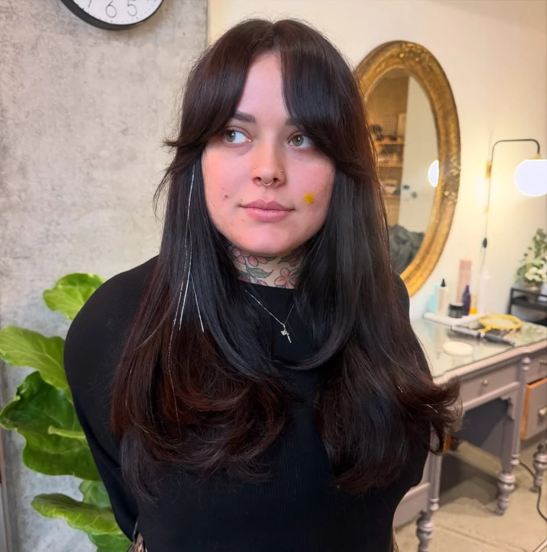 Dark Brown Layered Hair with Curtain Bangs and Tinsel Strands
