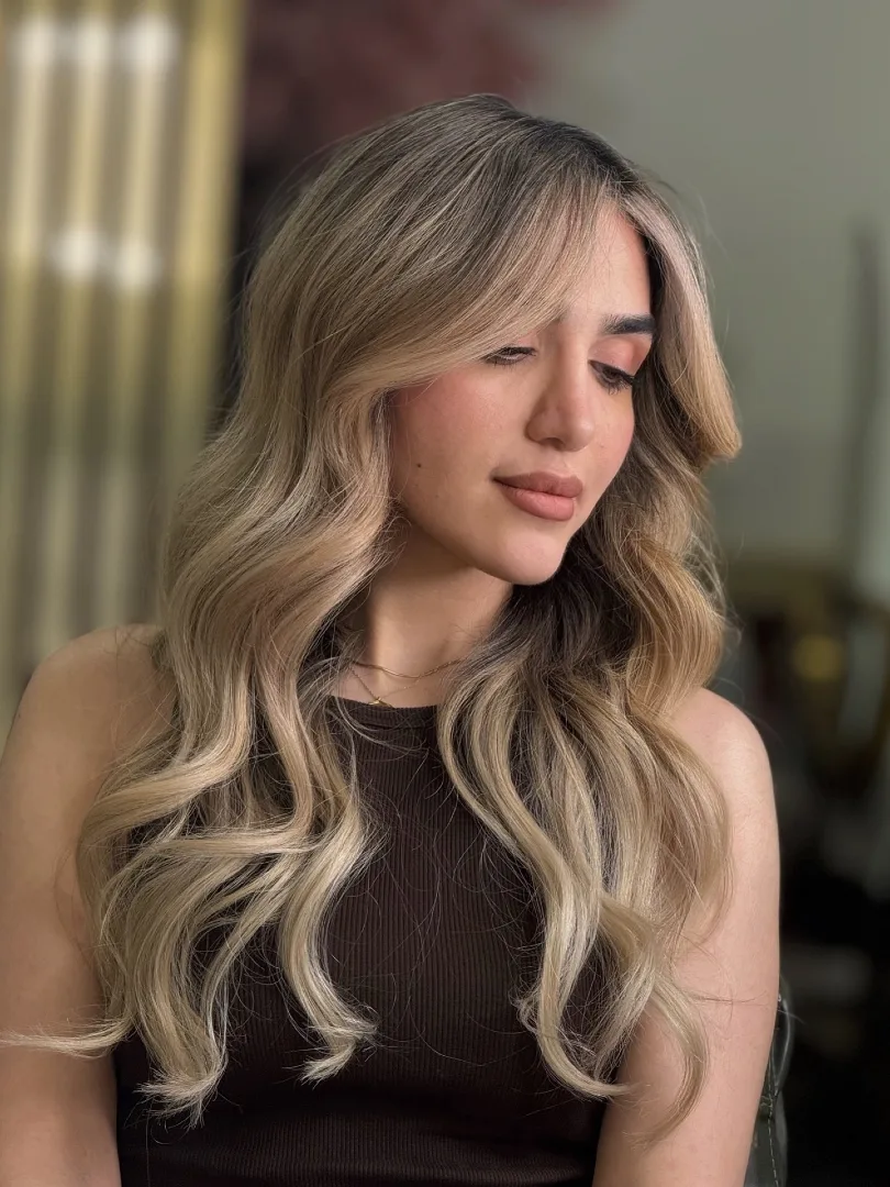 Dark Root Balayage with Creamy Blonde Curtain Bangs