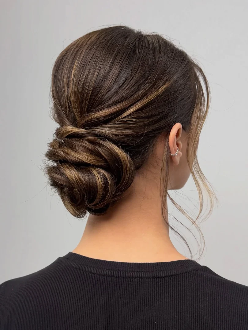Highlighted Brunette Low Swirl Updo