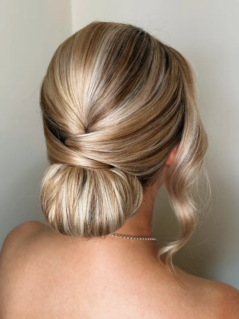 Low Bun with Side Swept Curl