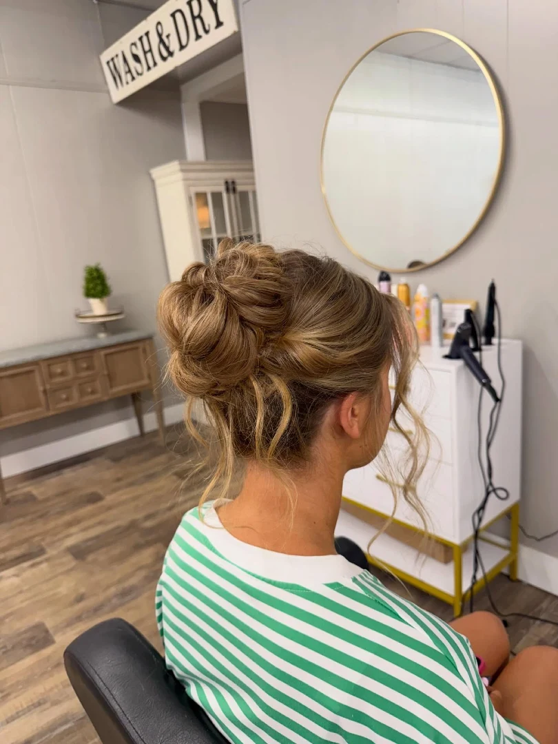 Messy High Bun with Curly Tendrils