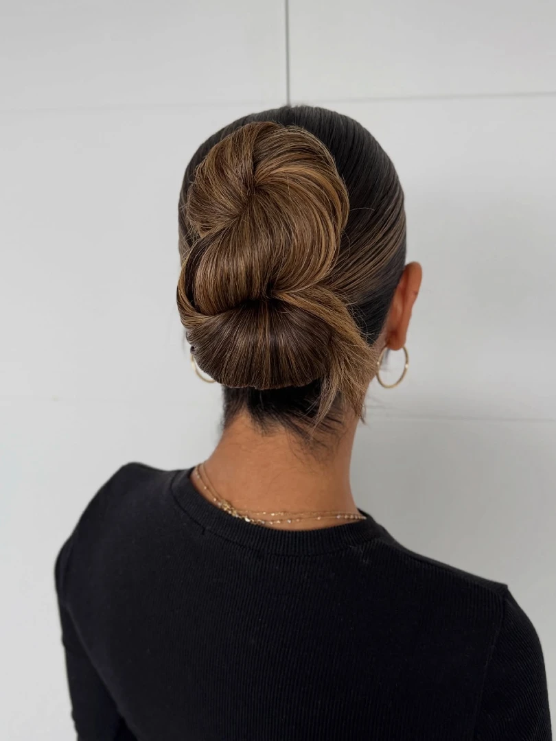 Sculpted High Swirl Bun with Caramel Highlights