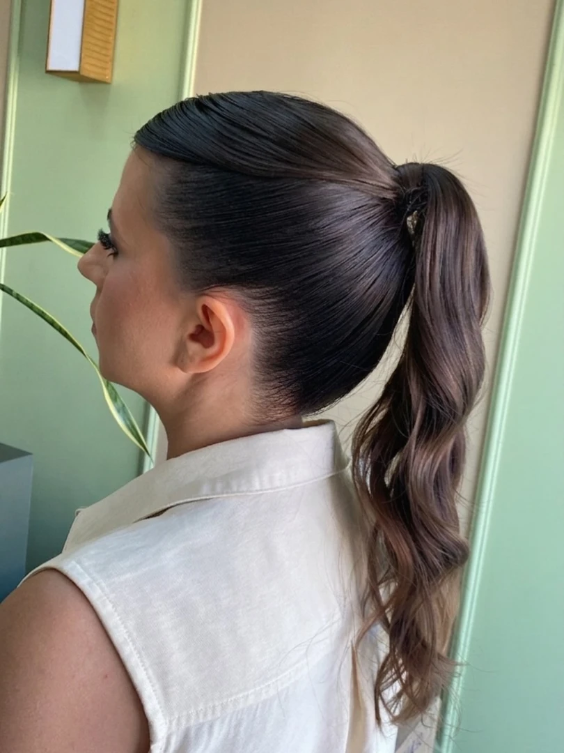 Slicked-Back Ponytail with Wavy Ends