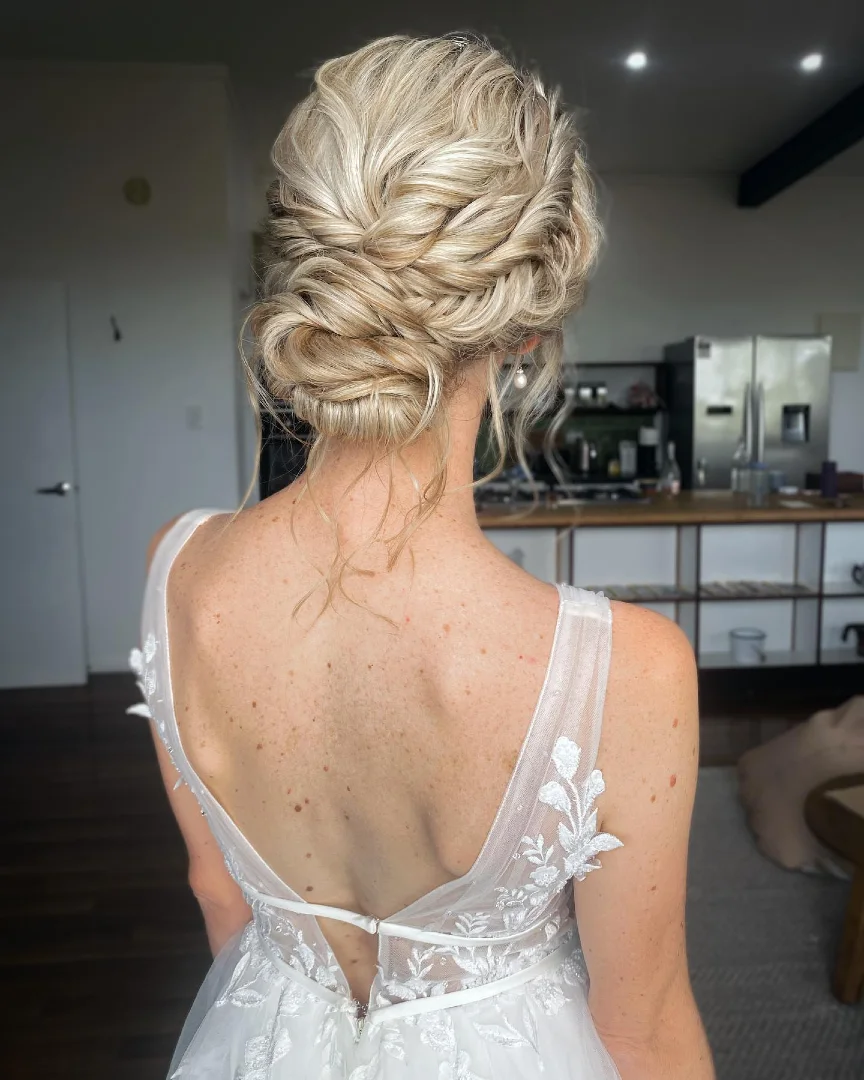 Textured Braided Low Updo with Wispy Tendrils