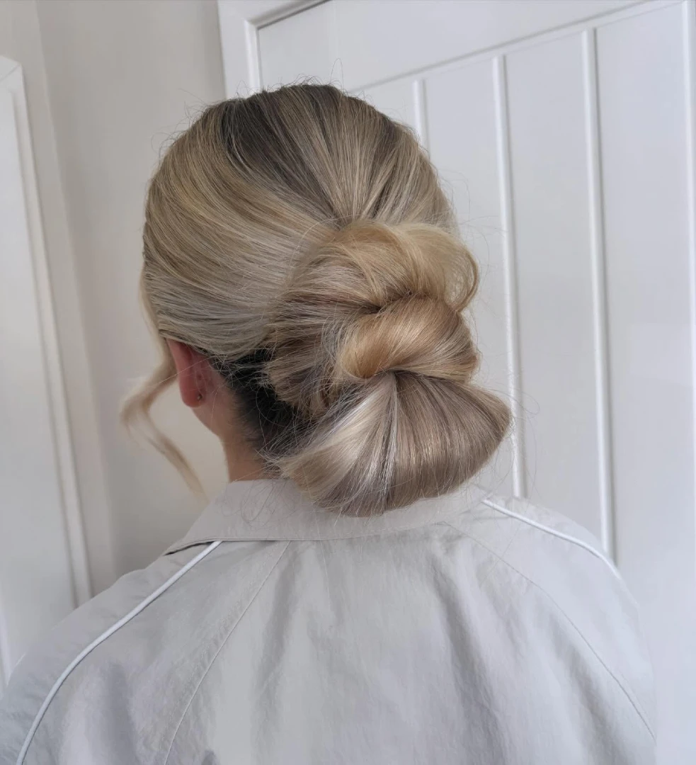 Voluminous Low Bun with Looped Tuck