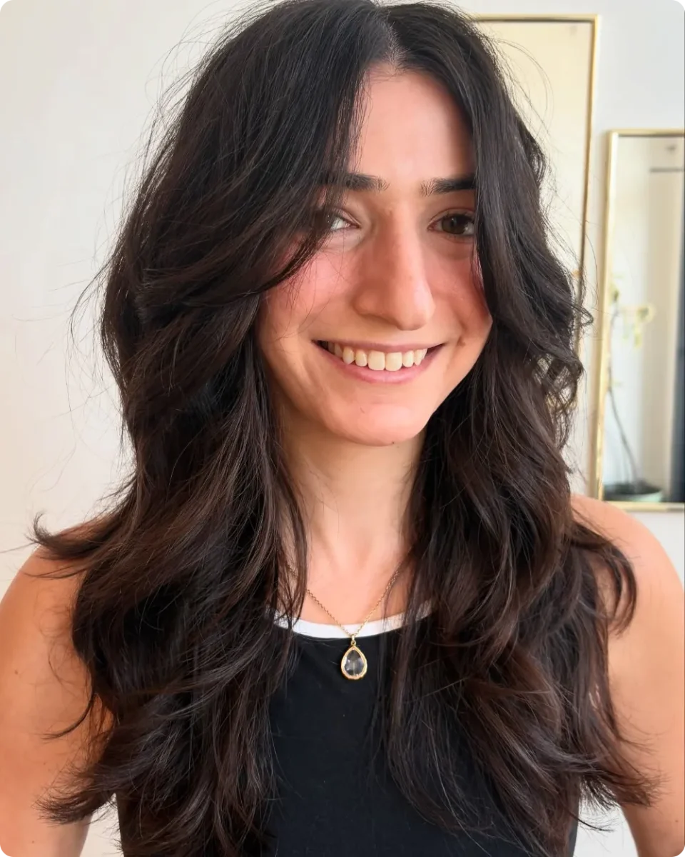 Undone brunette waves with choppy layers and an air dried finish