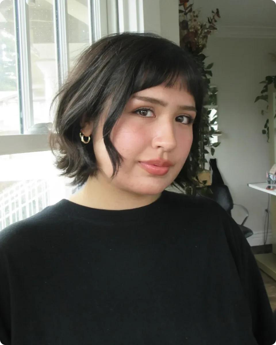 Dark textured bob with a wispy fringe and long face-framing pieces